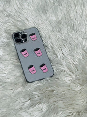 Grey phone case with pink coffee cup charms